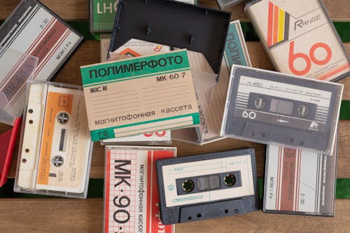 Free Cassette Tape on a Wooden Surface Stock Photo