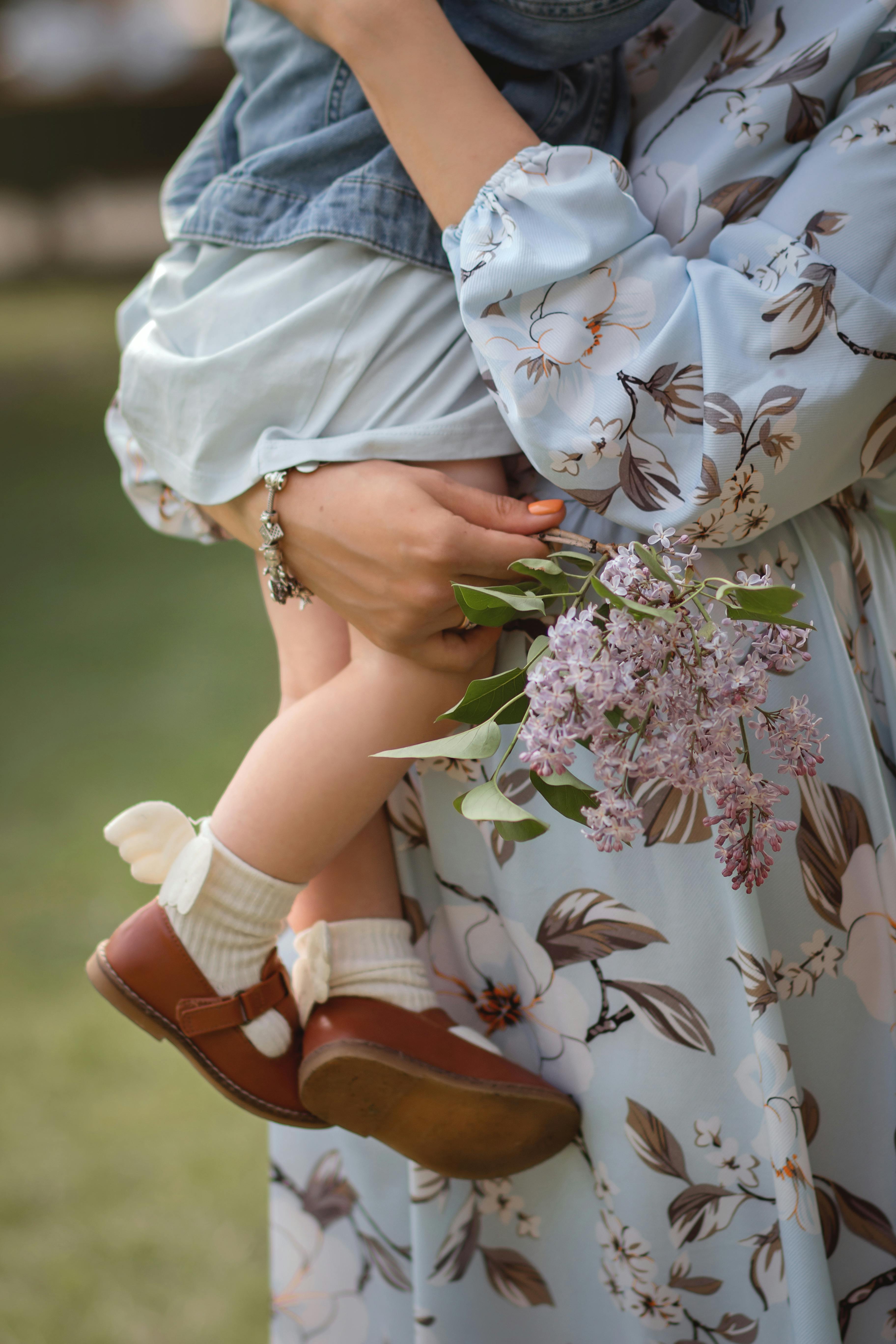 girl in white pink and green floral dress