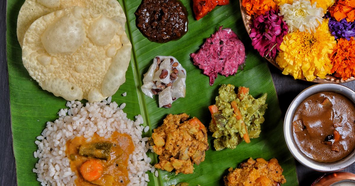South Indian vegetarian meal with many dishes and sweets on a banana leaf (catering in Ammoor, Vellore)