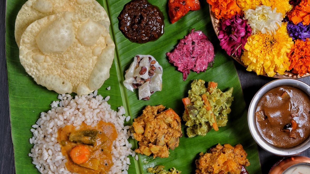 South Indian vegetarian meal with many dishes and sweets on a banana leaf (Hostel Catering in Vellore)