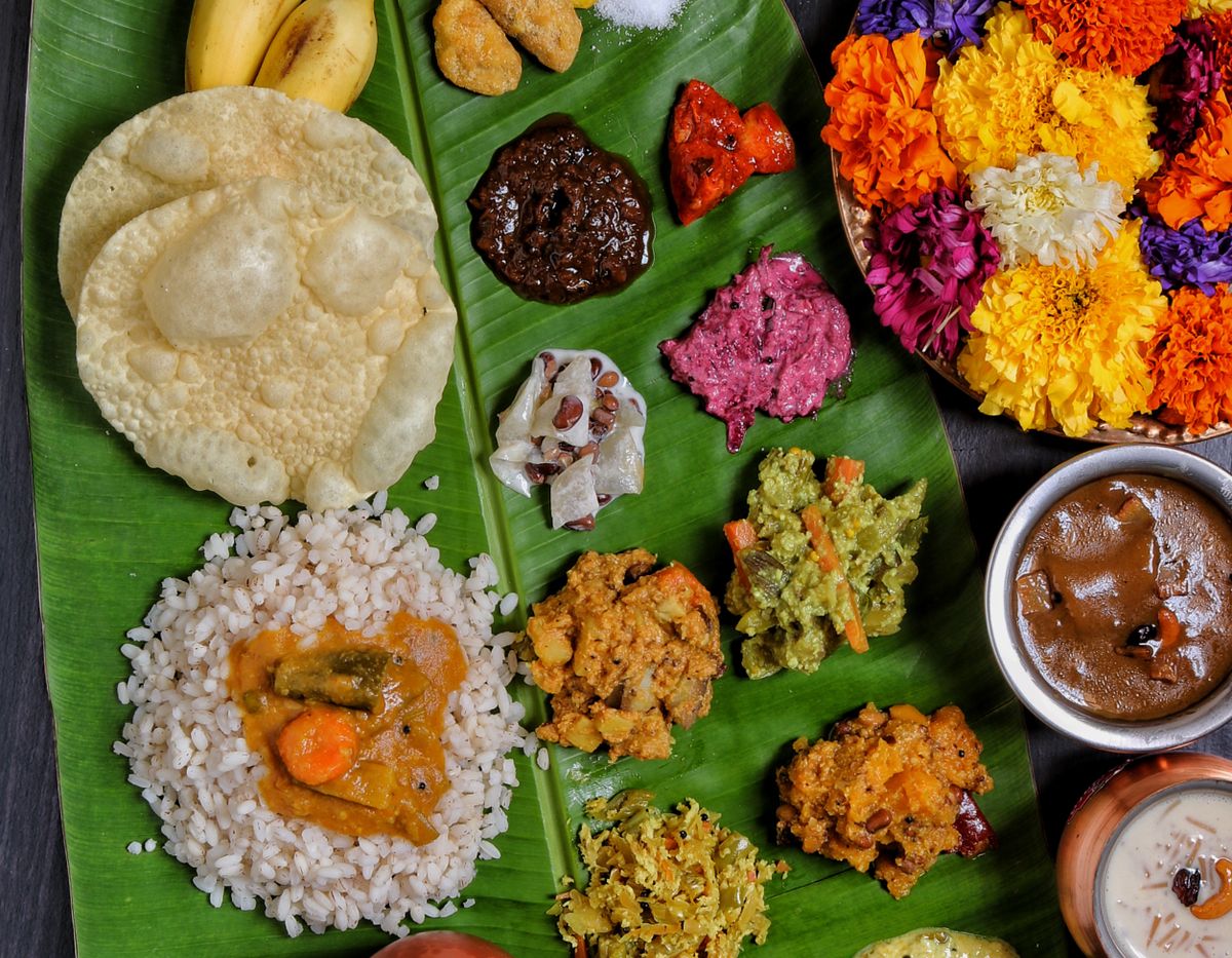 South Indian vegetarian meal with many dishes and sweets on a banana leaf
