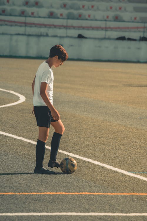 Free Boy Playing Football Stock Photo