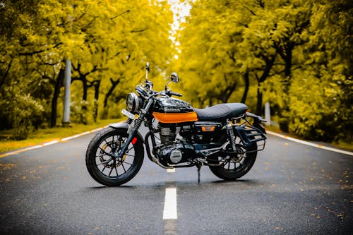 Free Black Motorcycle Parked on Gray Concrete Road Stock Photo