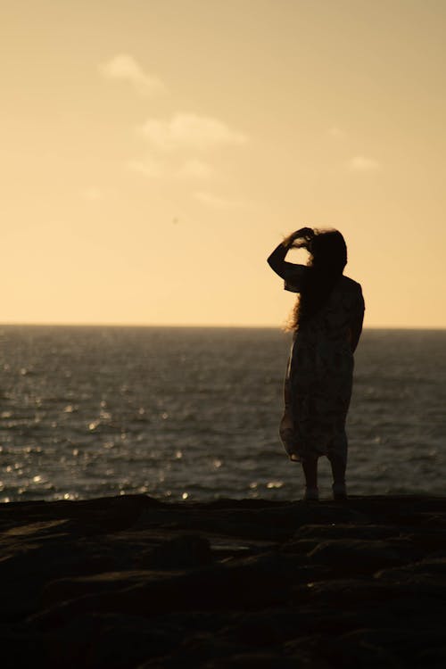 Woman Standing near the Sea