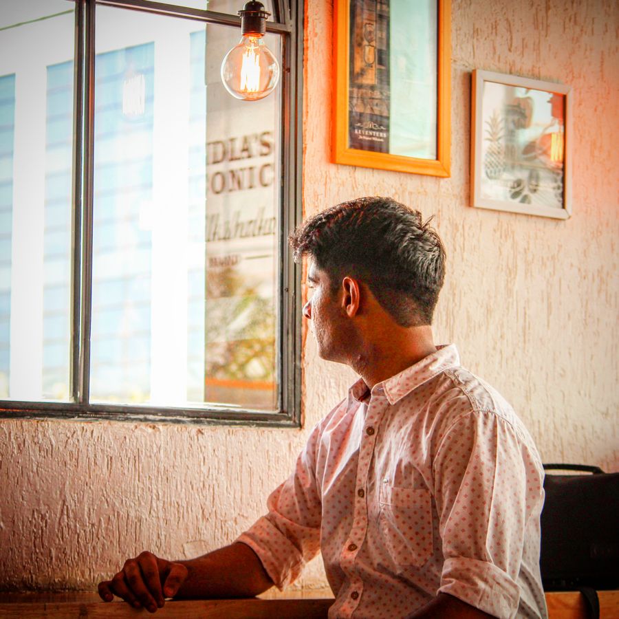 A partner thinking through a client mandate in the Otis Street office — photo by Naman Nayar on Pexels