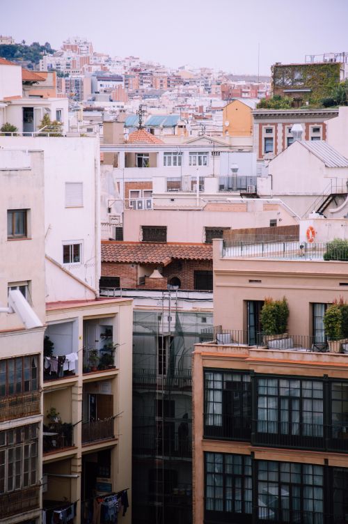 Free Vibrant view of Barcelona's rooftops and architecture, capturing the city's urban essence. Stock Photo