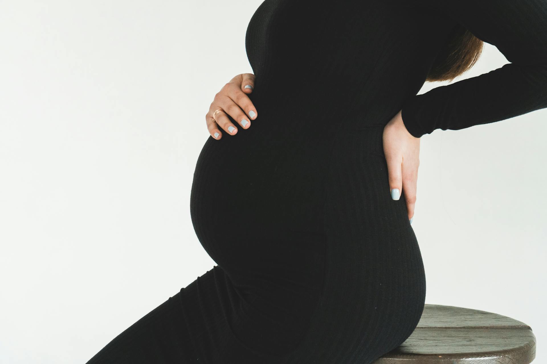 Woman Holding her Tummy and Back