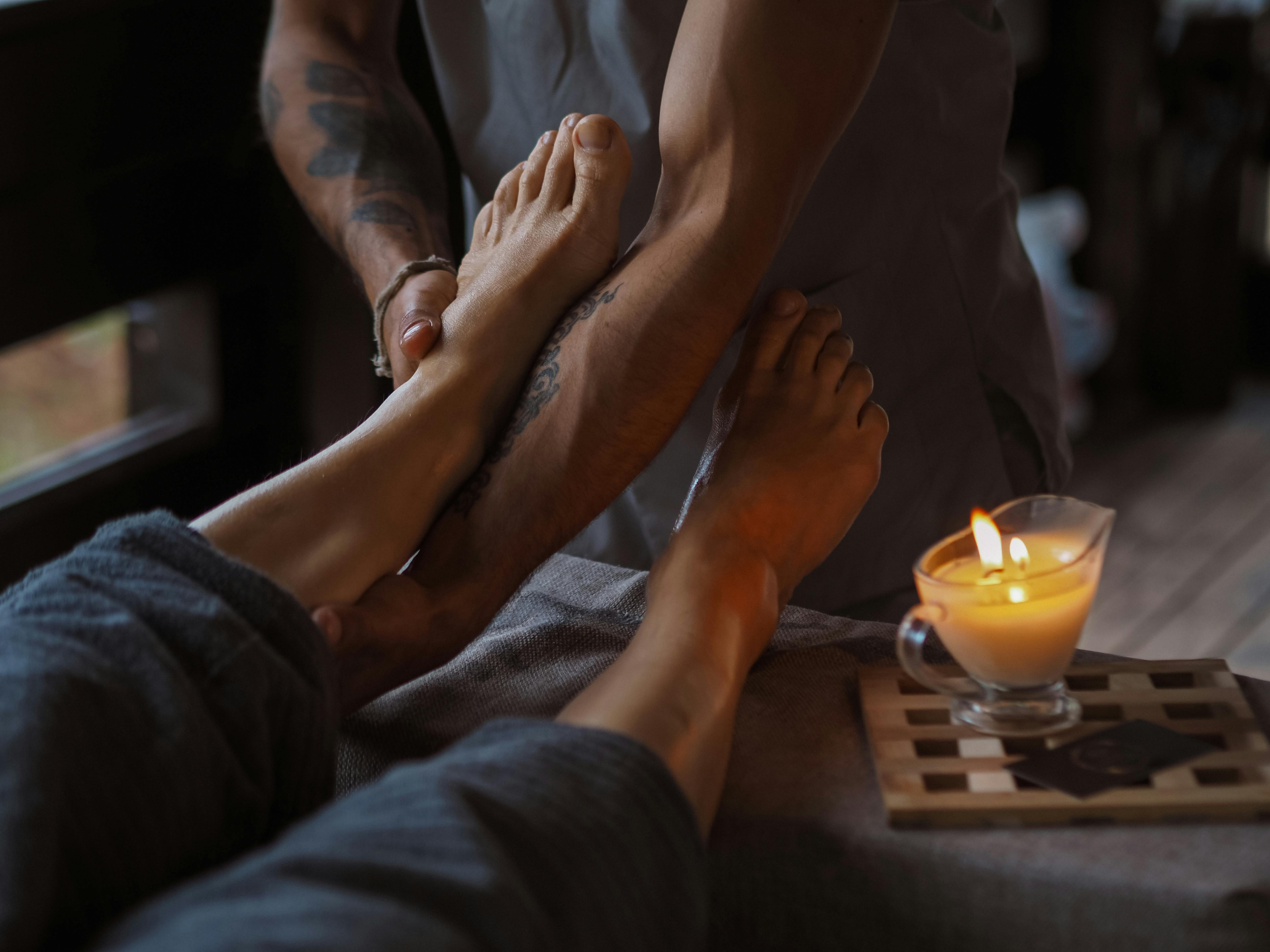 An image of a woman’s feet getting a massage