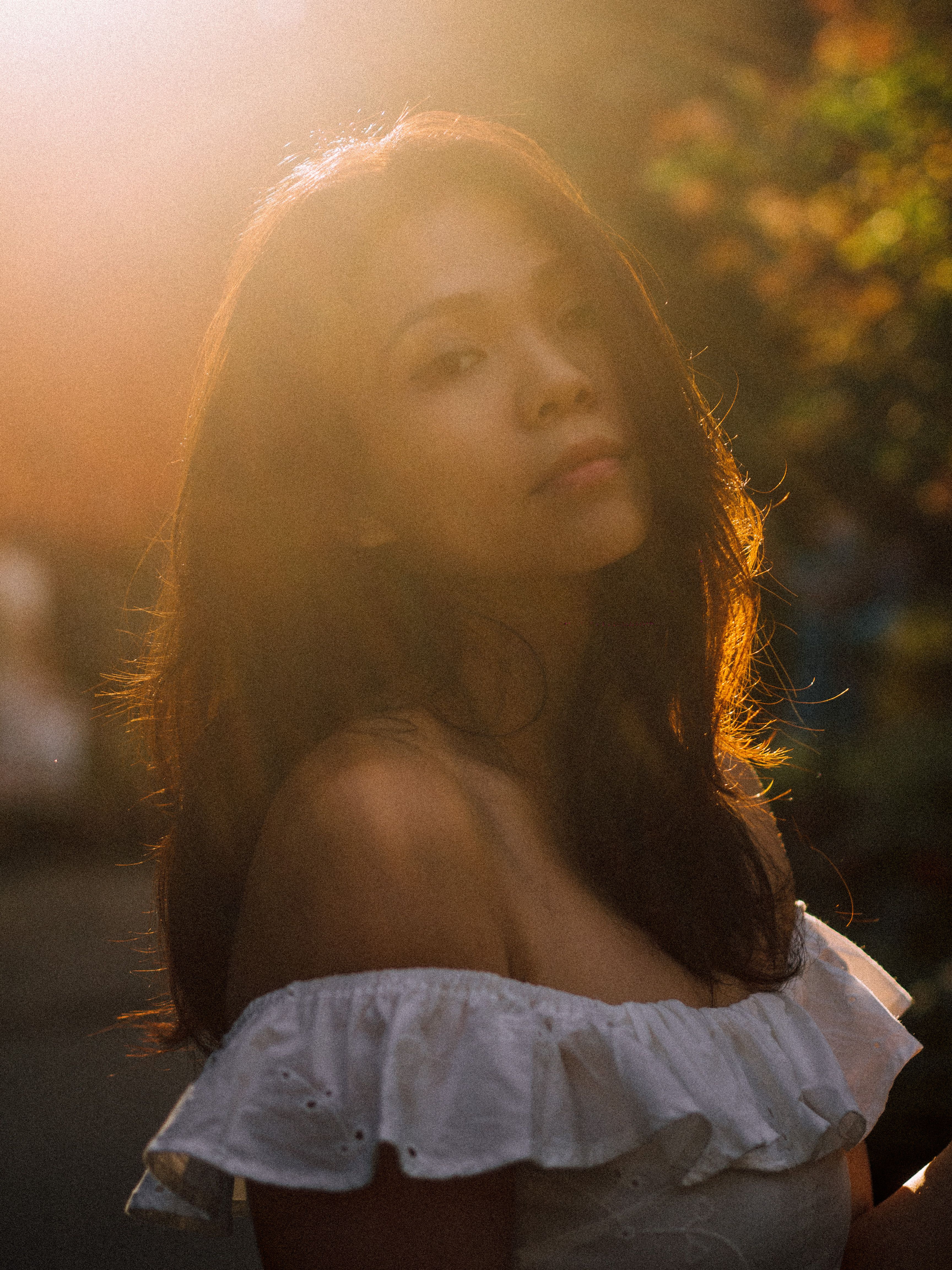 Beautiful outdoor portrait of a young woman in soft sunset lighting, exuding tranquility and elegance.. pexels, beautiful, ou