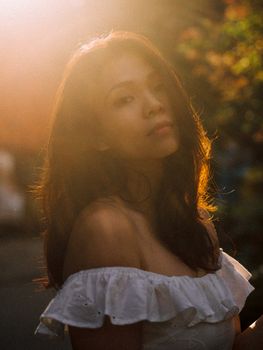Beautiful outdoor portrait of a young woman in soft sunset lighting, exuding tranquility and elegance.. pexels, beautiful, ou