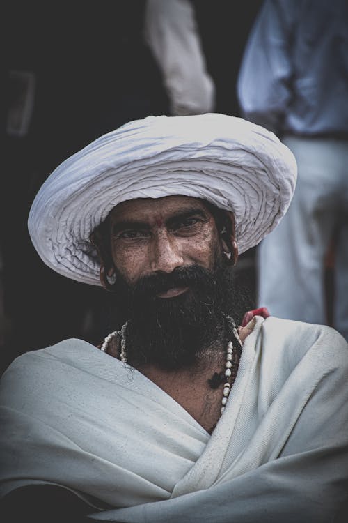 Man in White Hat and White Robe