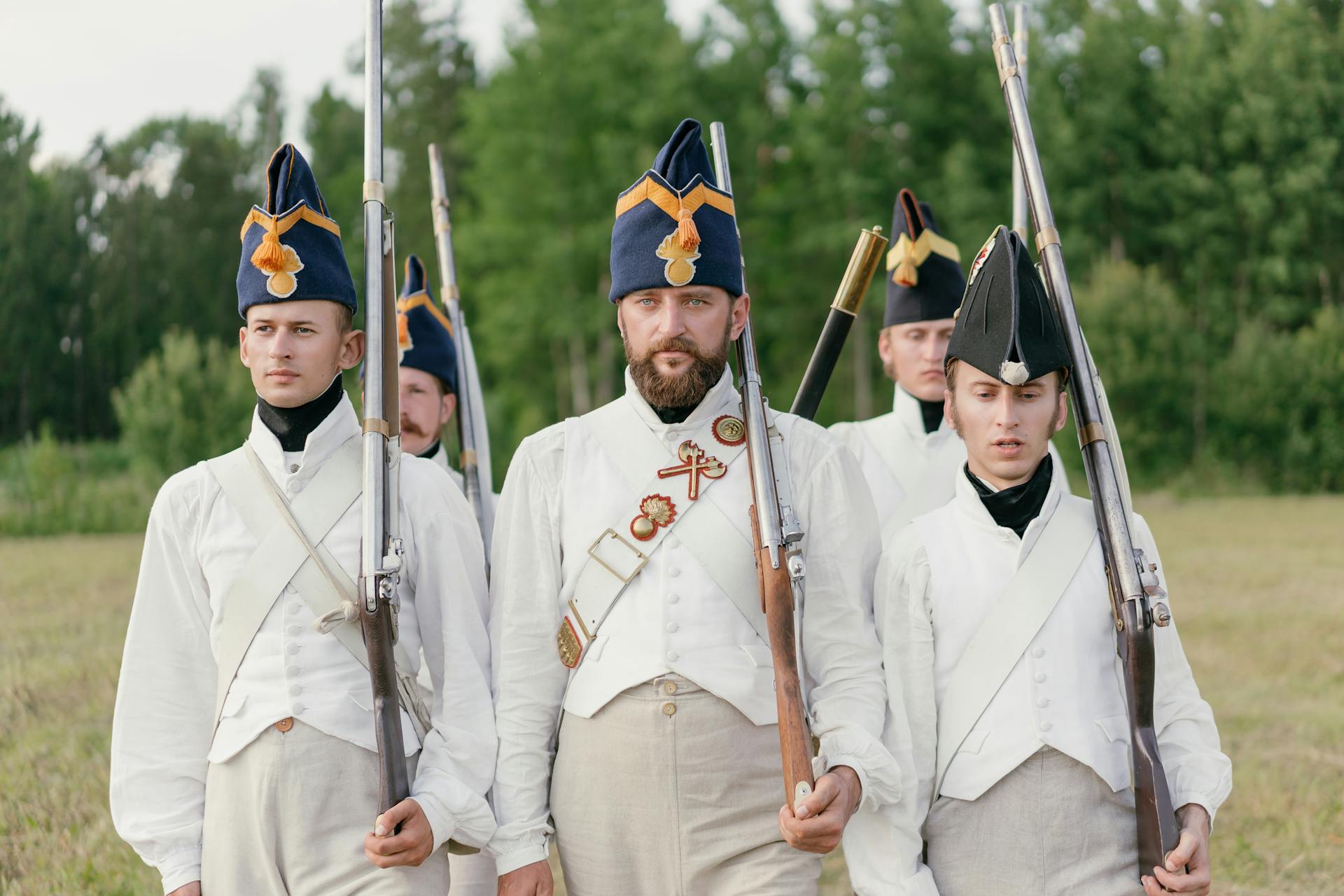 Soldiers Marching while Holding Rifles