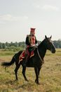 Man Riding a Black Horse