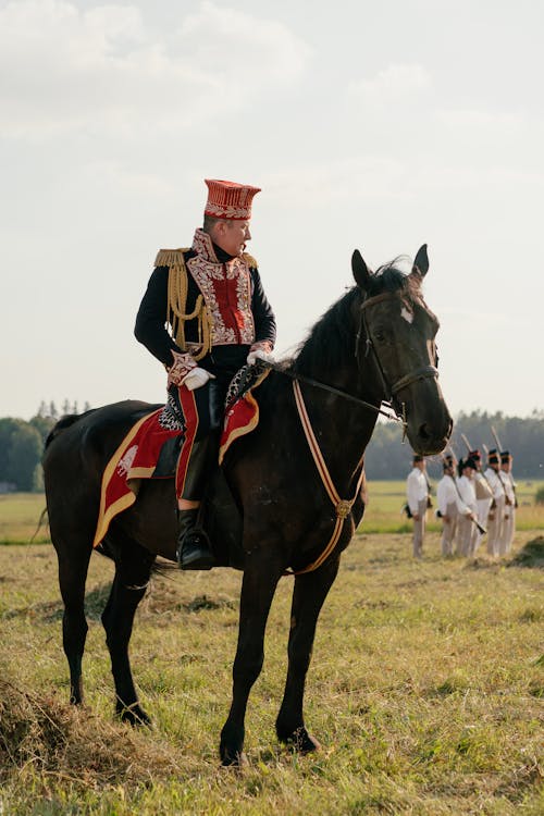 Soldier in a Historical Uniform Riding a Horse