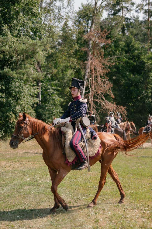 Soldier in a Historical Uniform Riding a Horse 