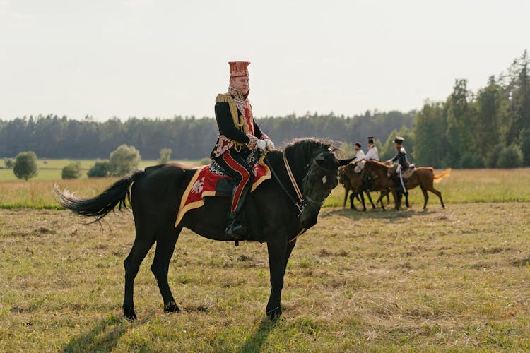 A Soldier Riding On A Black Horse