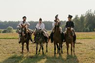Soldiers Riding on Horses on Grass Field