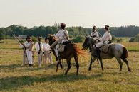 Men in Historical Clothes with Swords Riding Horses