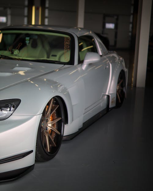 A White Coupe Sports Car inside the Garage