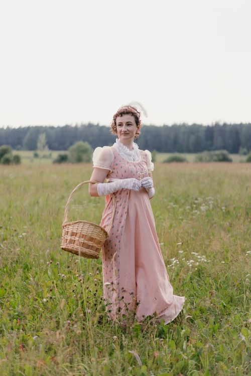 Portrait of a Woman in Pink Dress Standing on Grass · Free Stock Photo