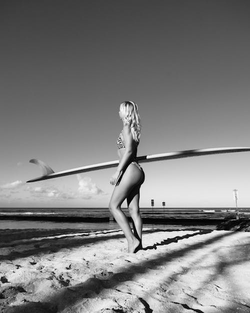 Monochrome Shot of a Woman Standing on Shore