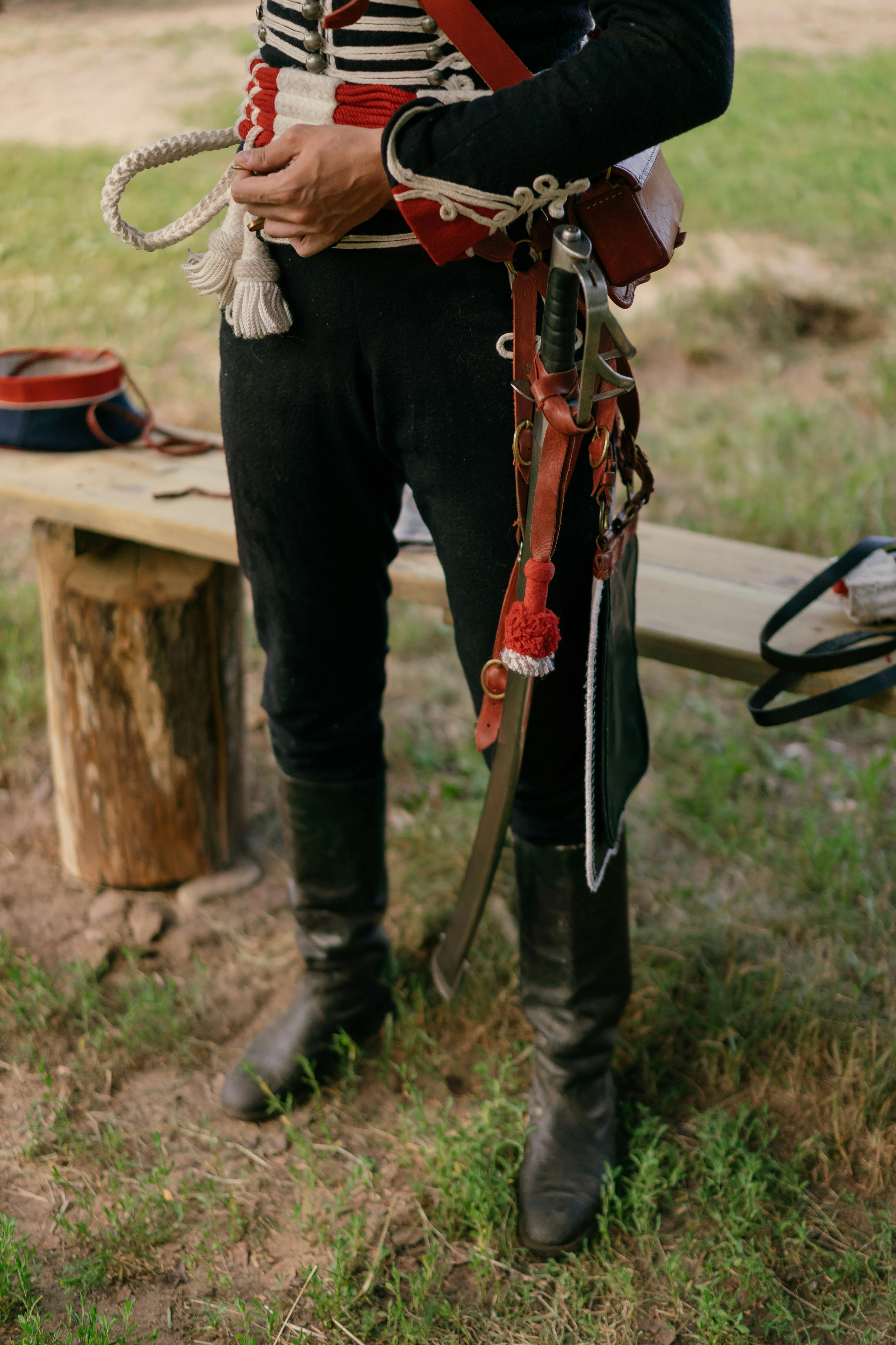 person in civil war officer uniform and sword at a reenactment