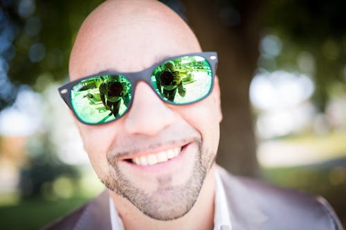 Free Shallow Focus Photography of Man in Gray Top Wearing Green Sunglasses With Black Frames Stock Photo