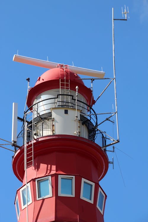 Free Low-Angle Shot of a Red Lighthouse Stock Photo