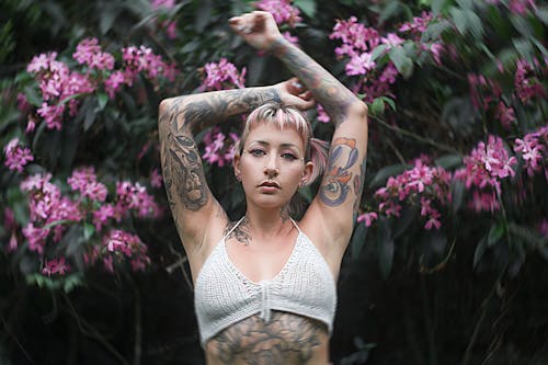 Woman in White Crop Top Raising Her Hands