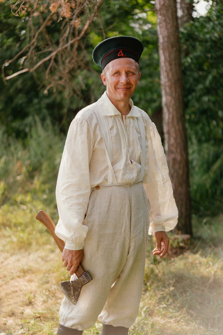 A Man Holding A Hatchet