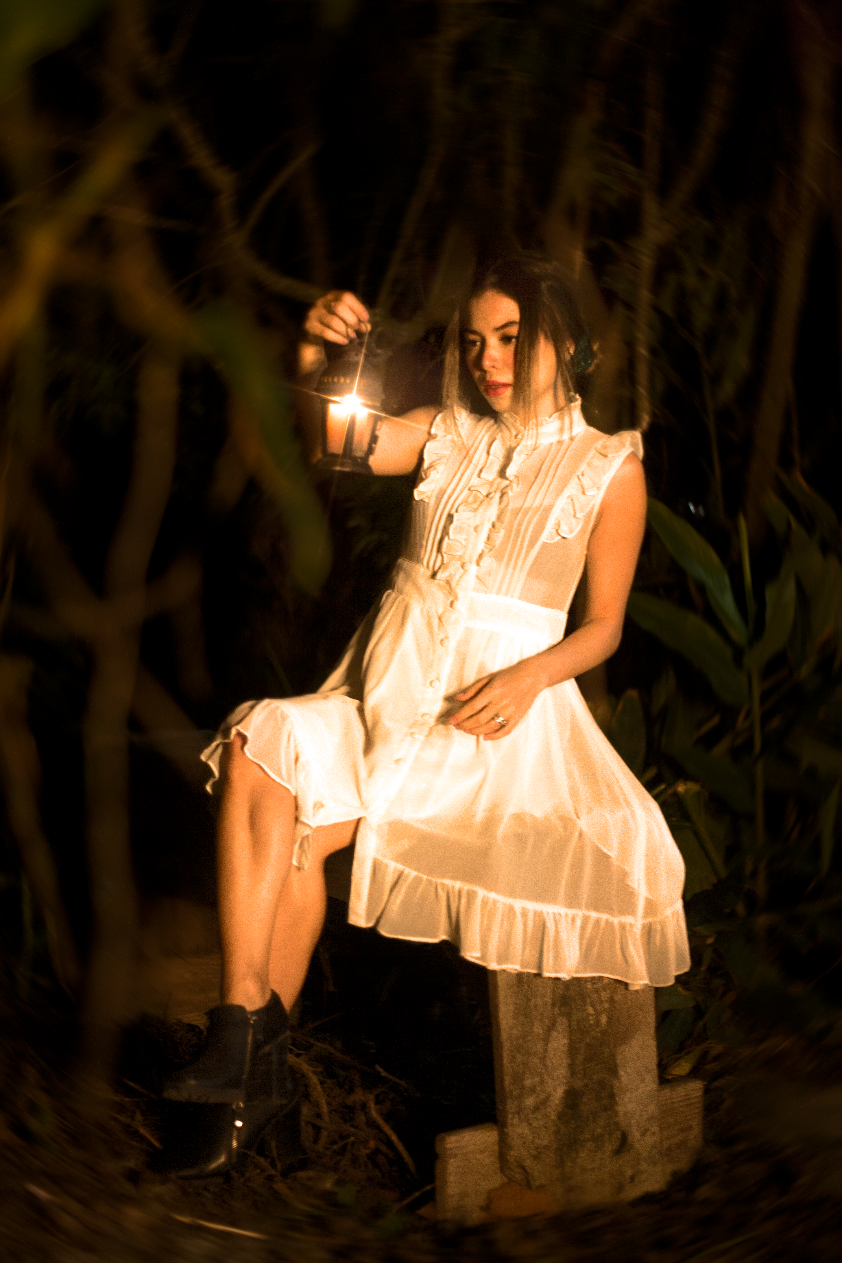 A Woman in White Dress Sitting while Holding a Kerosene Lamp · Free ...