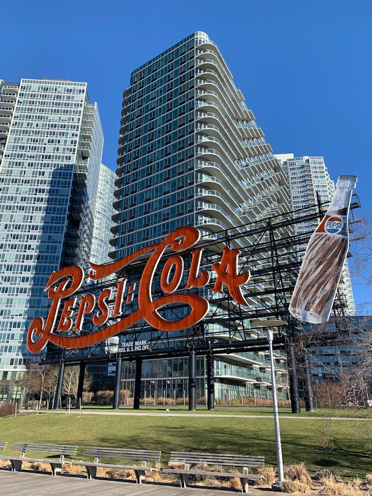 Billboard Of Pepsi Cola Near Buildings