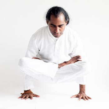 An Indian yogi gracefully performing an advanced yoga pose, exuding calm and concentration.
