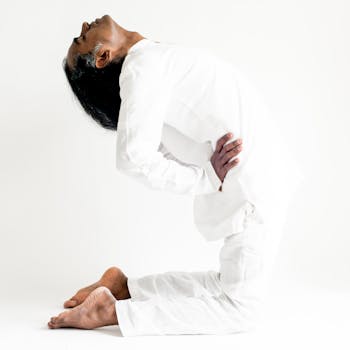 A man practicing yoga in camel pose, embodying peace and mindfulness. Ideal for health and wellness themes.