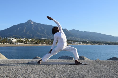 Free Flexible Man Doing Yoga Stock Photo