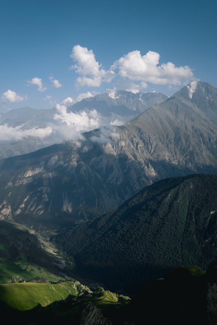 Scenic View Of A Mountain Range In Summer