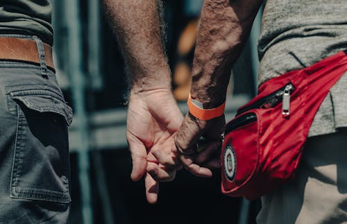 Close-up of Men Holding Hands 