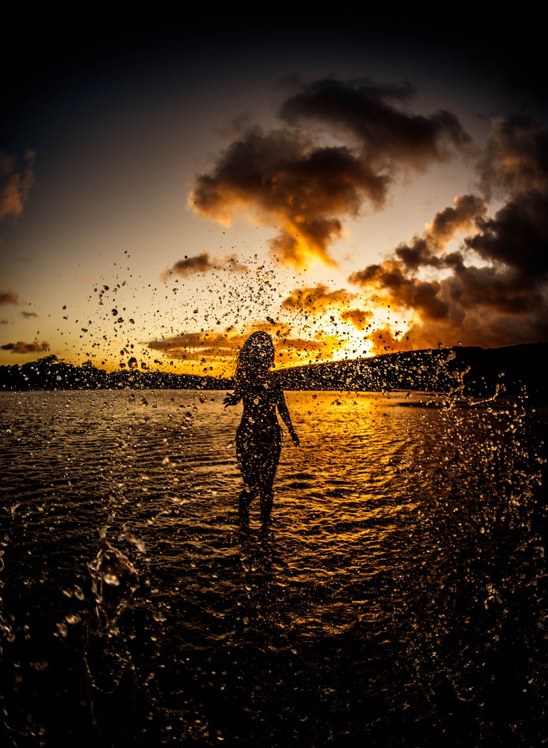 Silhouette of a Woman Standing on the Beach during Sunset · Free Stock ...
