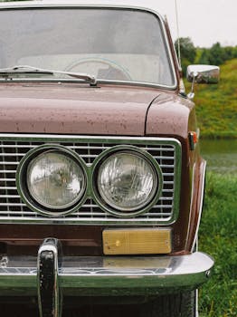 Close-up of a classic vintage car with chrome details parked outdoors.