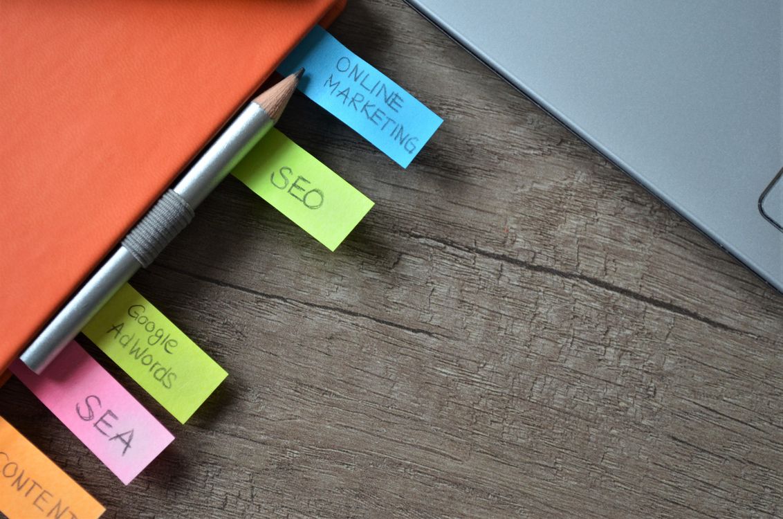 SEO keyword planning notes and strategy planner with sticky notes on a notebook