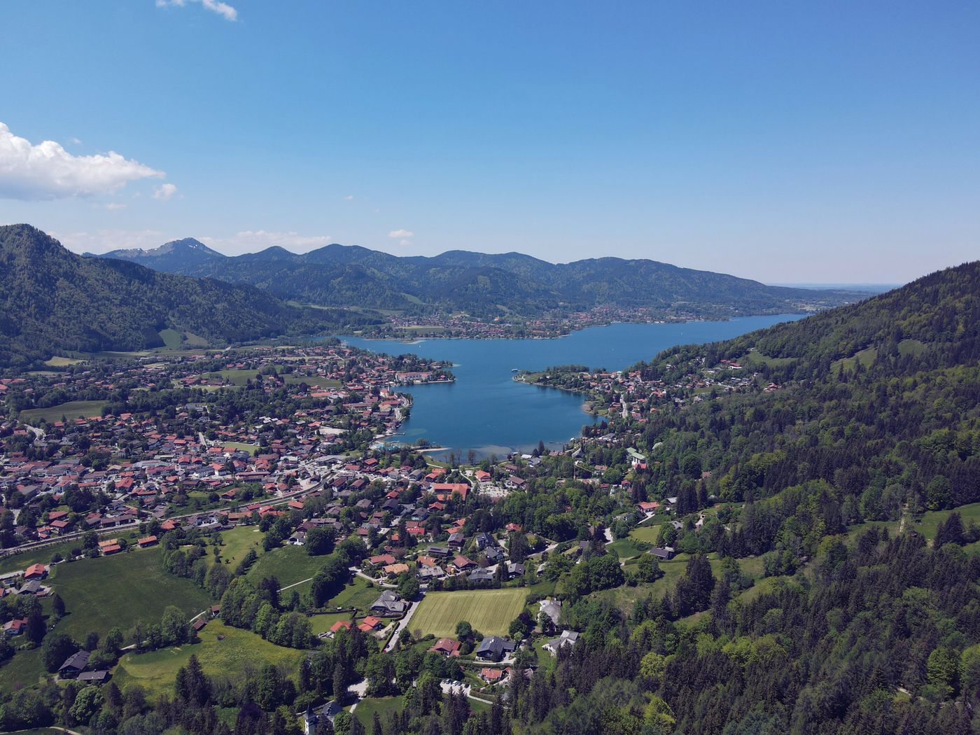 Aerial view of the Tegernsee lake, its lakeside town and the surrounding Bavarian hills