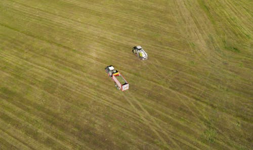Aerial View of Tractors on a Grassy Field