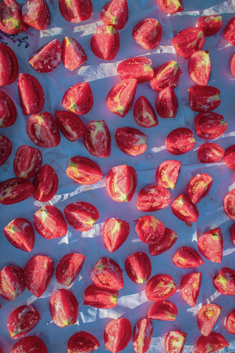 Sliced Tomatoes On A White Cloth 