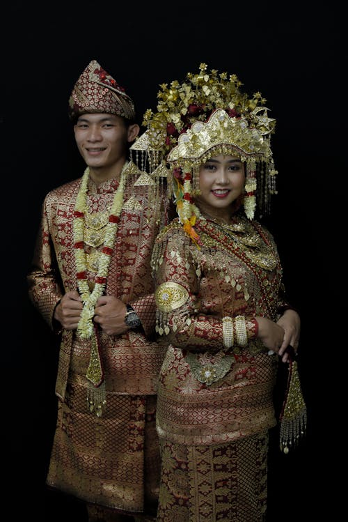 A Couple in Gold Traditional Clothes