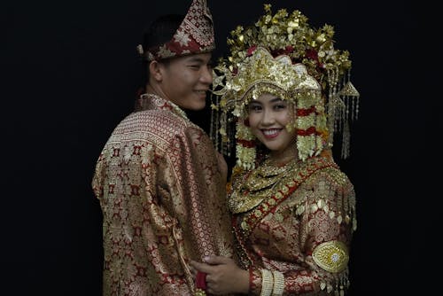 A Couple in Gold Traditional Clothes