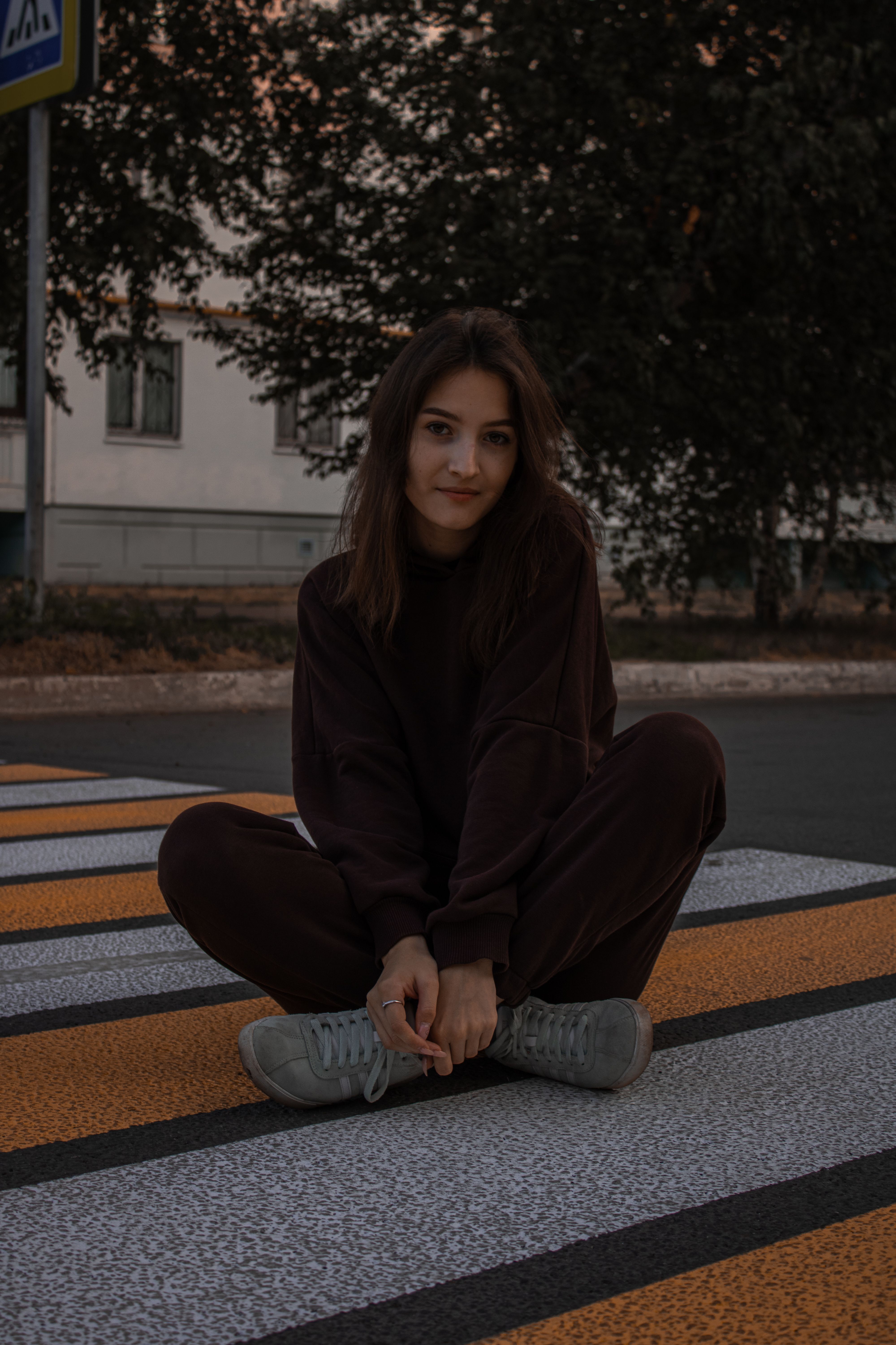 A Woman in Black Sweater Sitting on the Ground · Free Stock Photo