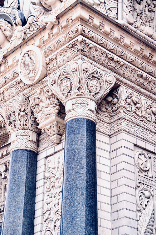 Free Close-up of intricately detailed classical architecture with ornate columns. Stock Photo