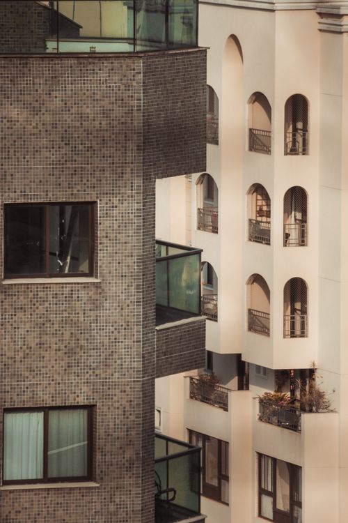 Free A close view of modern and classic urban residential buildings with balconies. Stock Photo