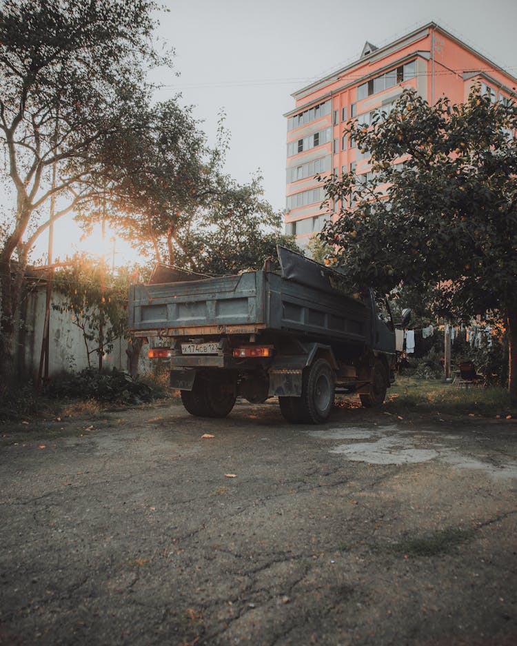 Truck Near Building And Trees