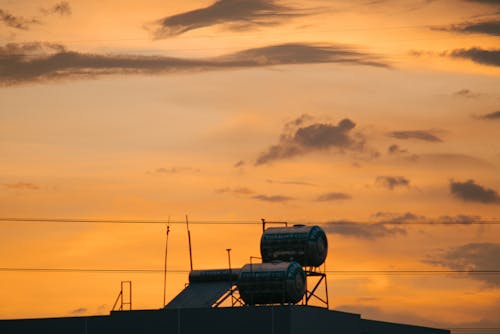 Základová fotografie zdarma na téma budova, oranžová obloha, průmysl